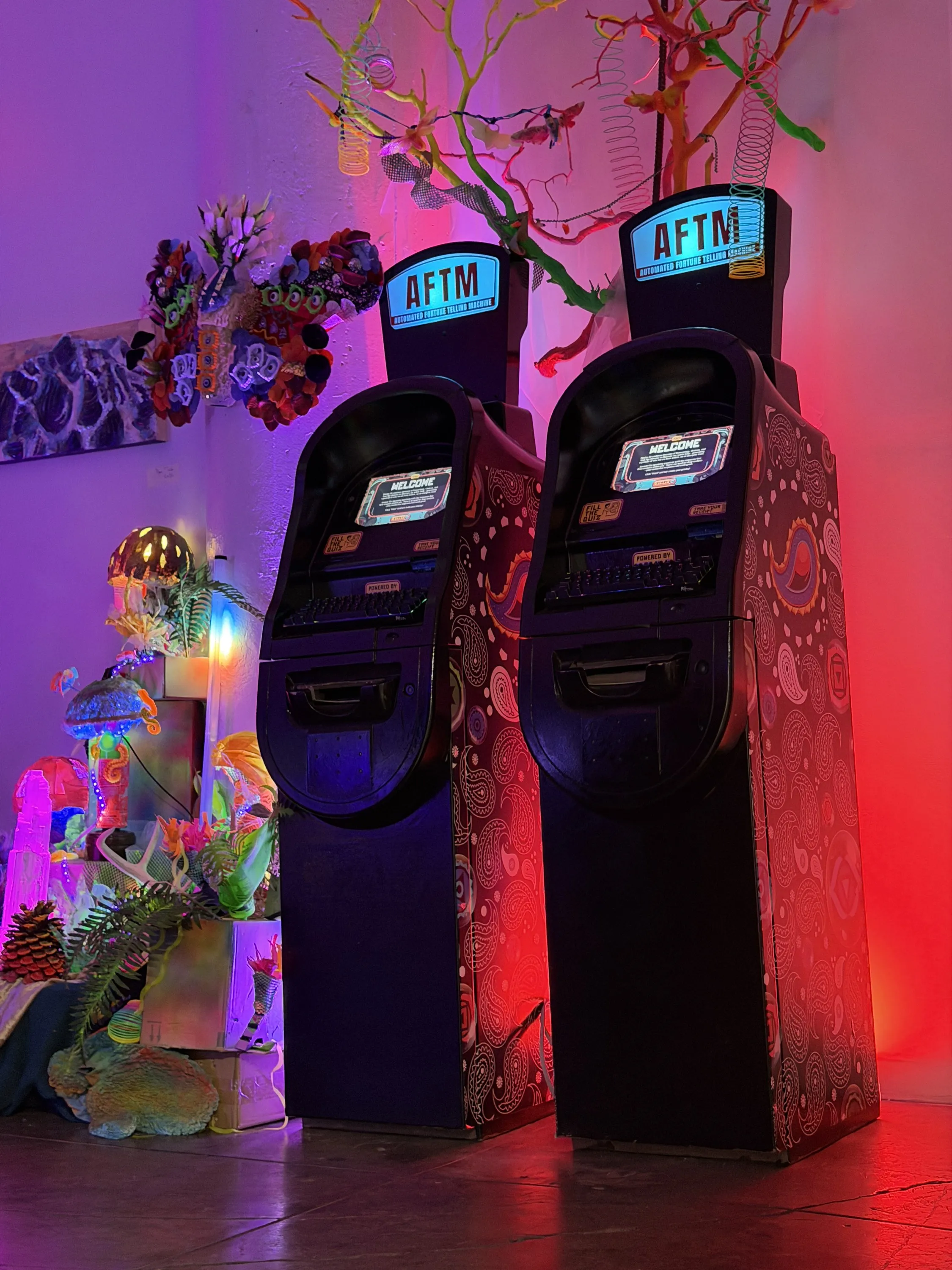 Two AFTMs side by side at Bu Tea Den, lit red and purple