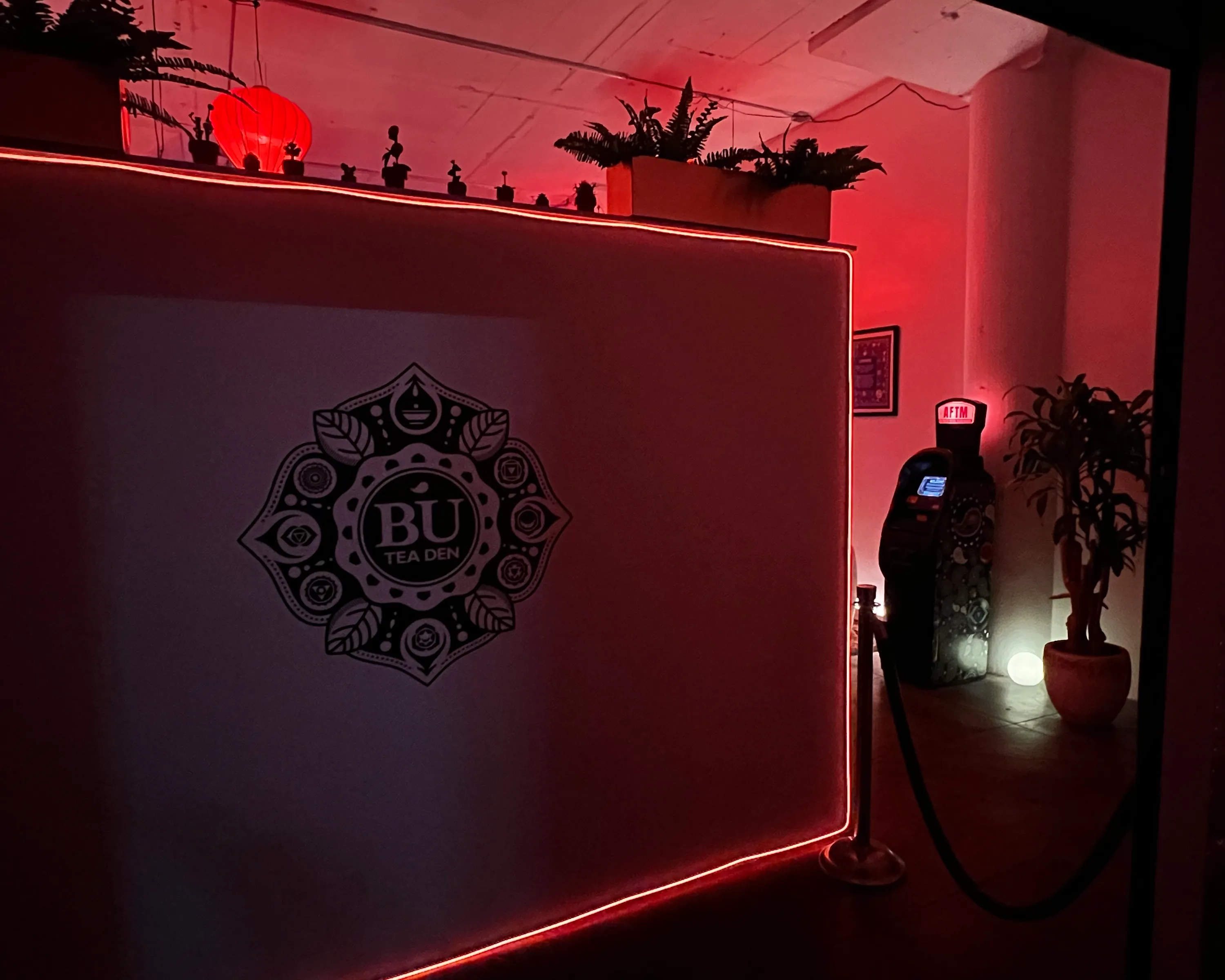 The Bu Tea Den mandala wall, an AFTM glowing in the corner beyond