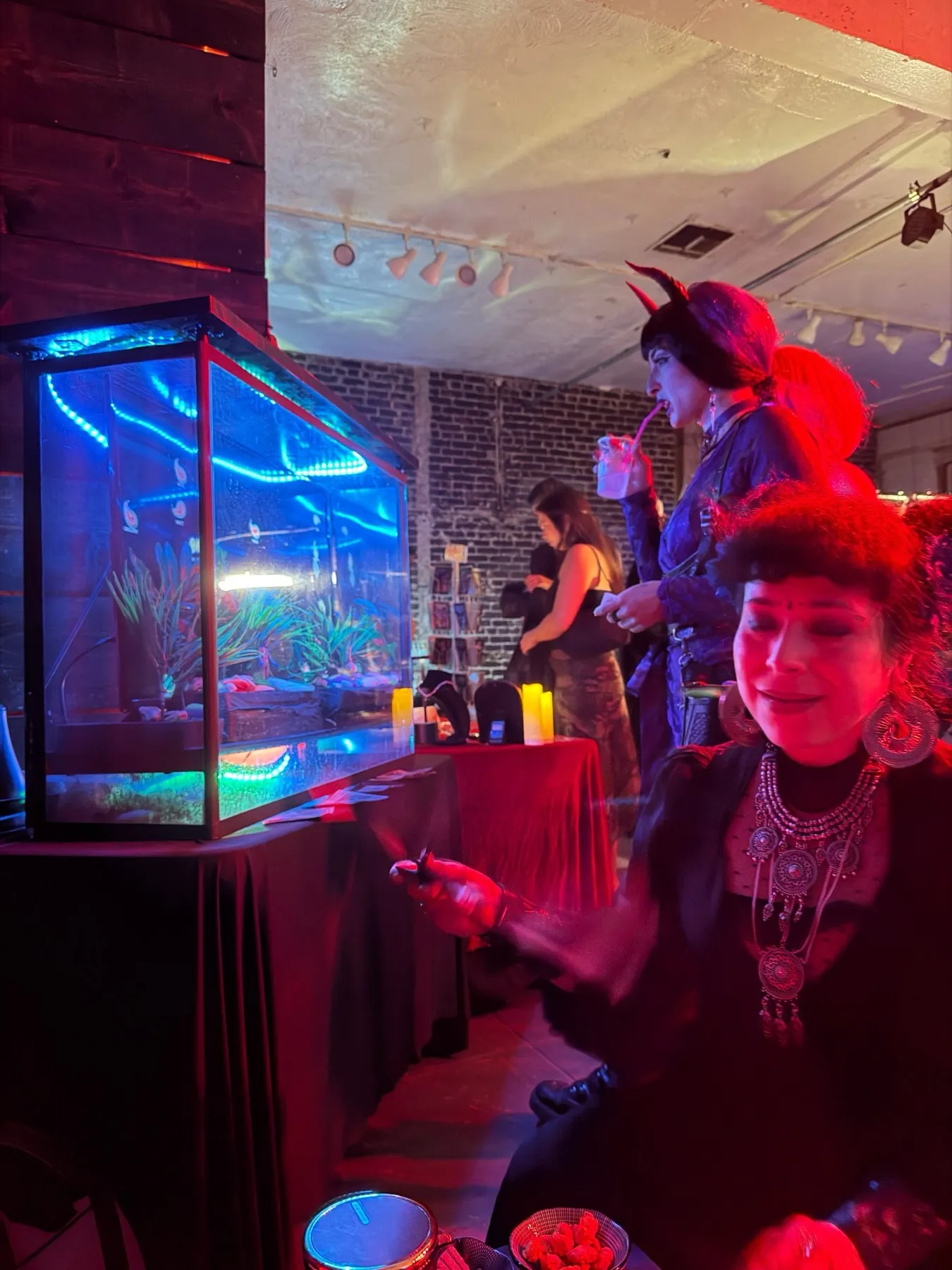 Guests in costume next to the paisley tank at Leviathan