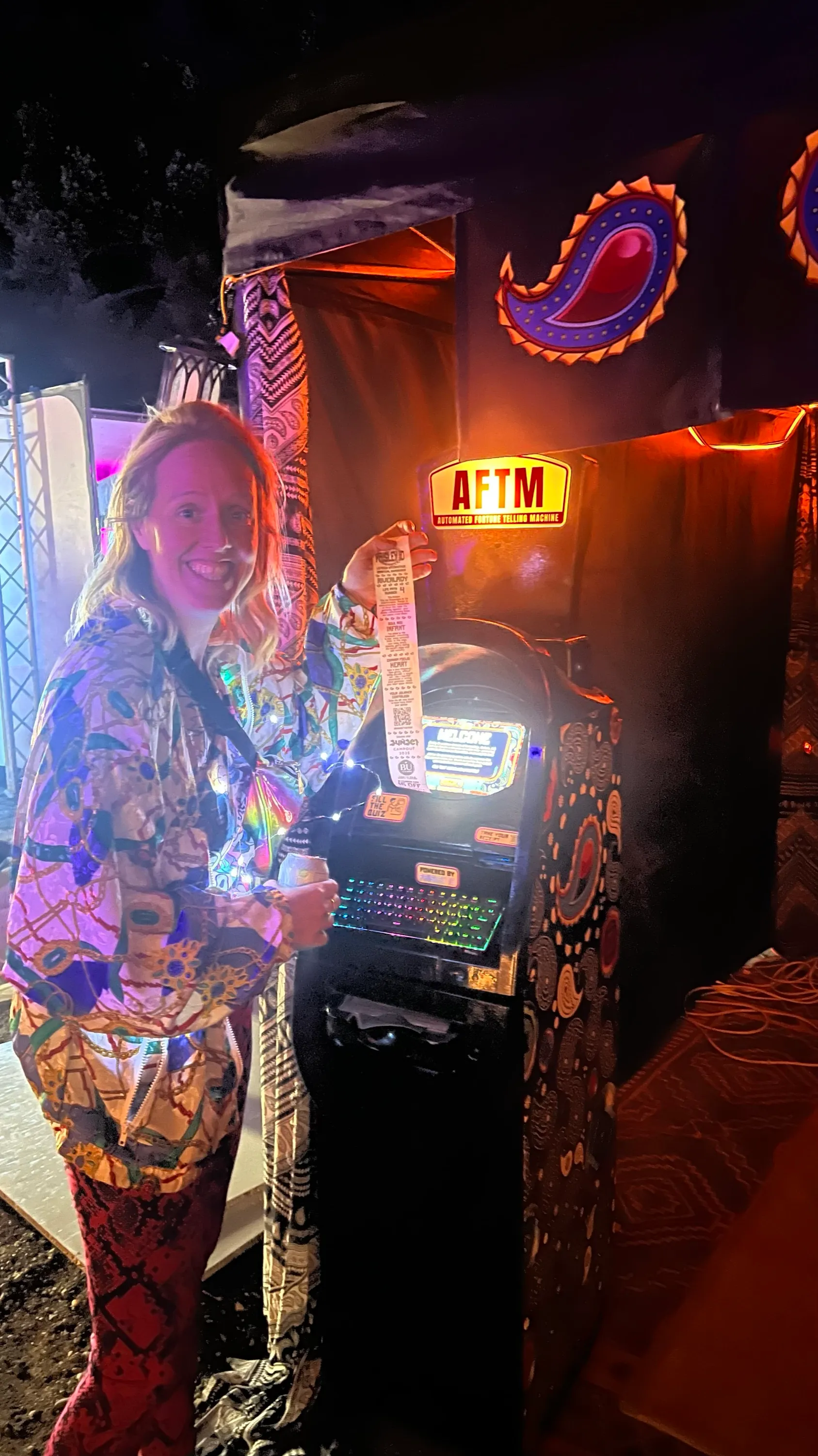 A guest at the AFTM holding up her fortune ticket