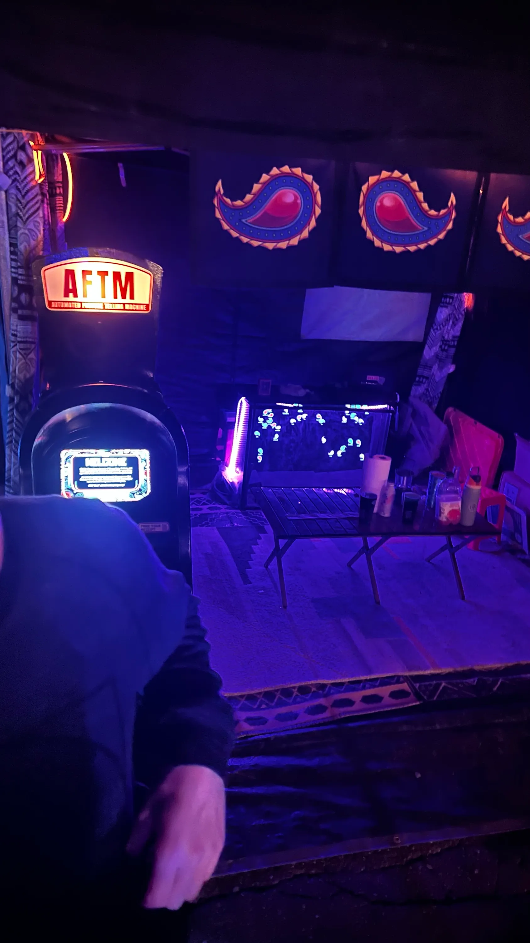The AFTM and the aquarium on a TV inside the tent