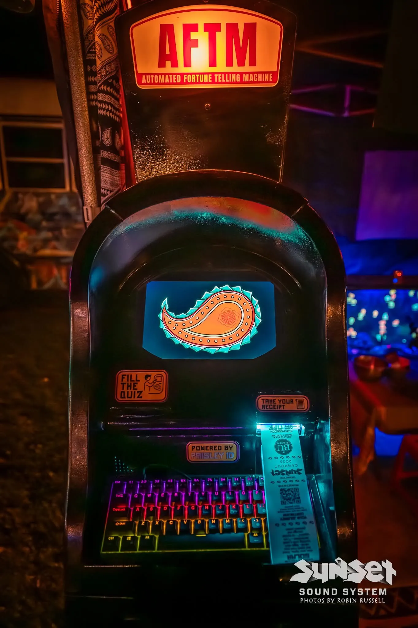The AFTM showing a freshly drawn paisley as a Sunset Campout 2025 ticket prints. Photo by Robin Russell for Sunset Sound System
